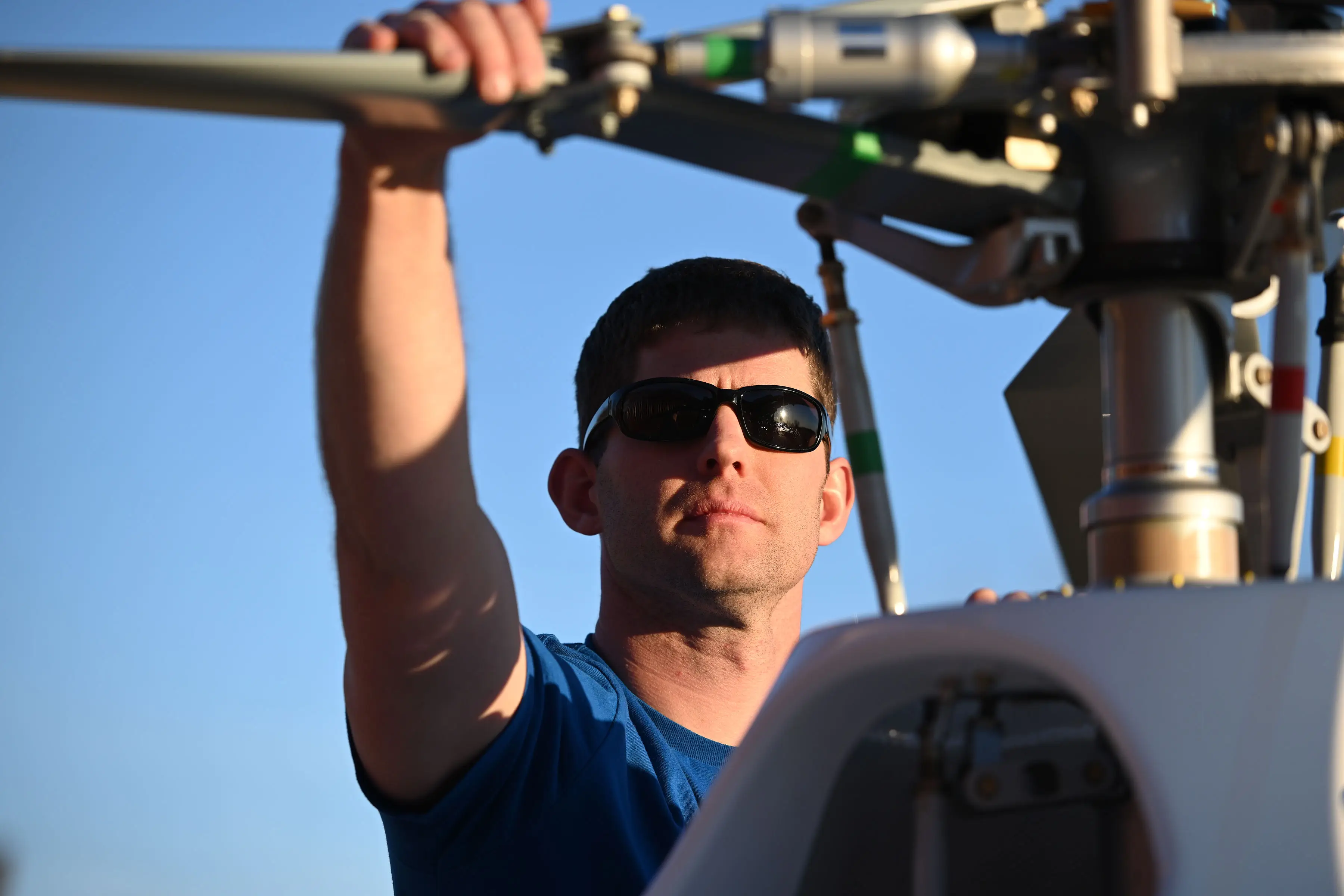 Helicopter parked in front of TruFix Maintenance hangar